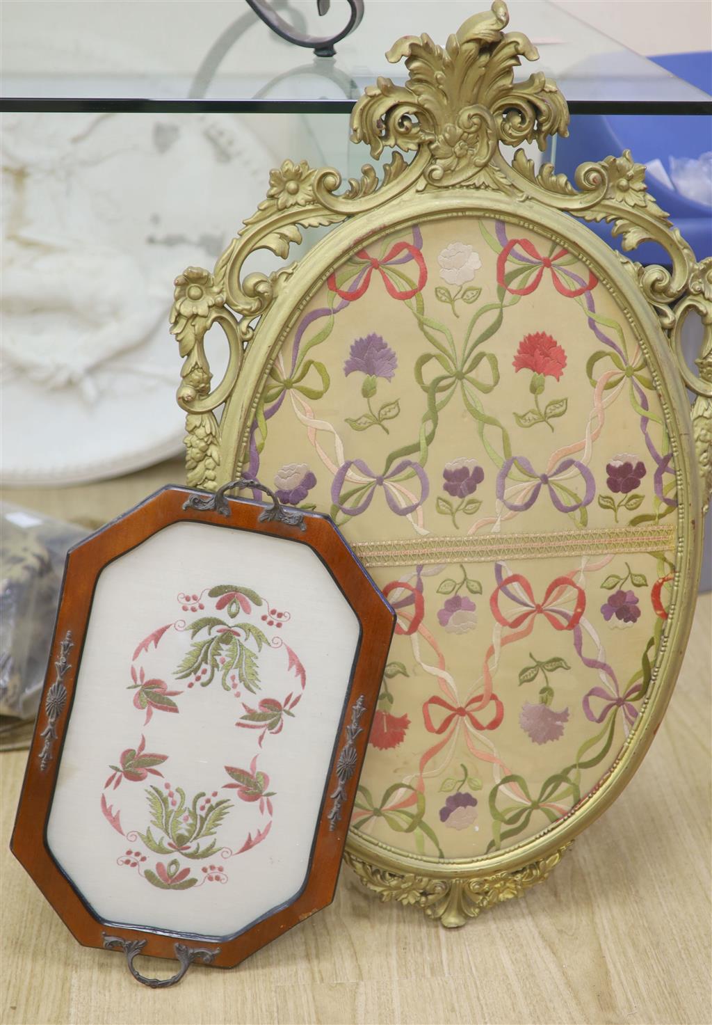 An oval needlework panel and another, largest 39 x 59cm